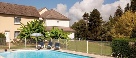 Seasonal outdoor pool, open 9 AM to 9 PM, pool umbrellas, pool loungers