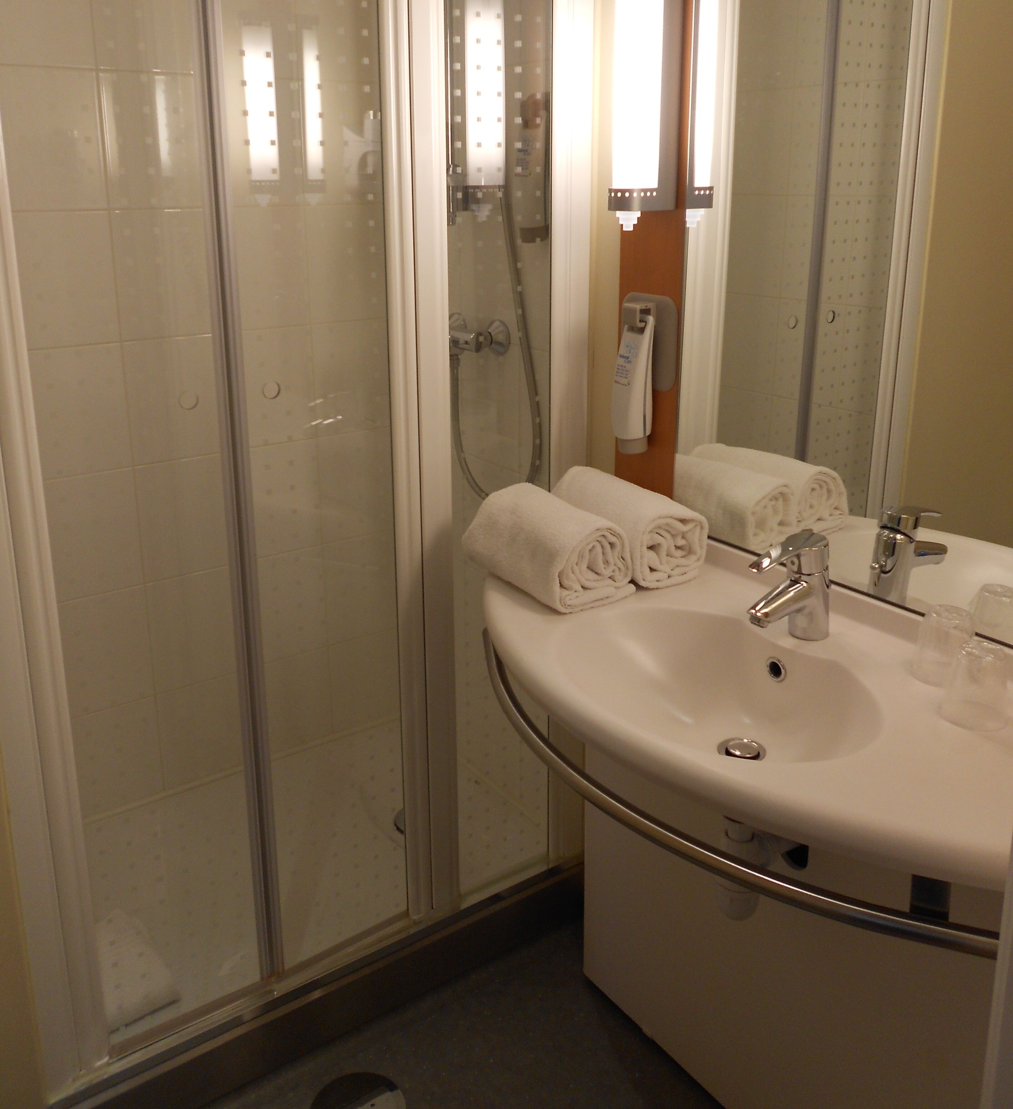 shower, eco-friendly toiletries, hair dryer, towels