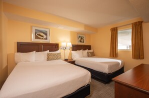 A hotel room with two beds, a desk, and a window with curtains. - Grande Shores Ocean Resorts Condominiums (Myrtle Beach)