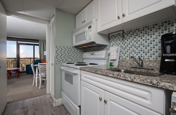 Standard Condo, Non Smoking, Partial Ocean View | Private kitchenette | Full-size fridge, microwave, oven, stovetop at Grande Shores Ocean Resorts Condominiums