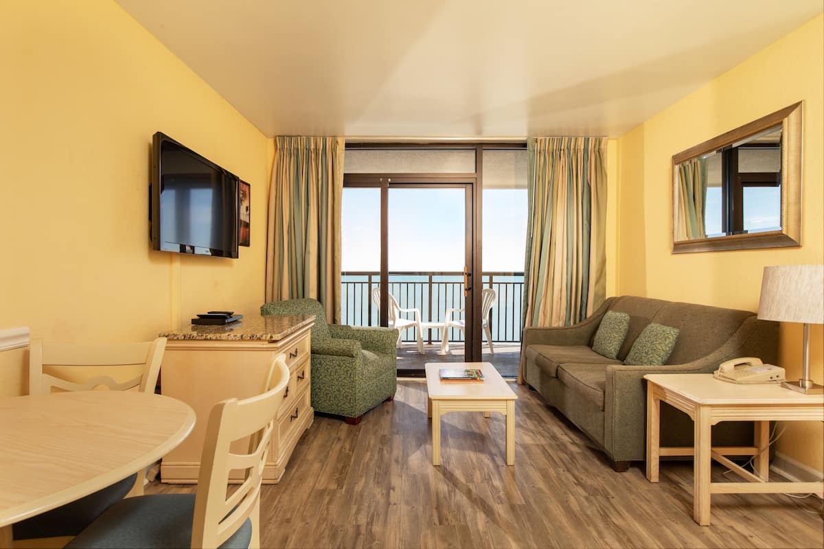 Deluxe Condo, 1 Bedroom, Non Smoking, Oceanfront | Living area | 27-inch flat-screen TV with cable channels, TV, DVD player