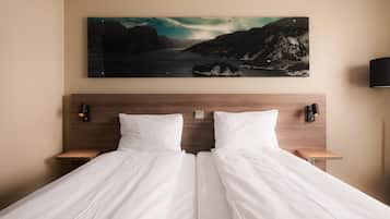 Down duvets, pillow-top beds, in-room safe, desk