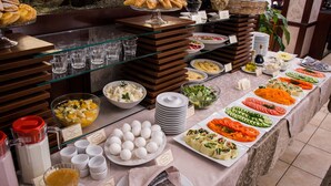 A buffet with various food items, including fruits, vegetables, and pastries. - Panska Gora (Lviv)