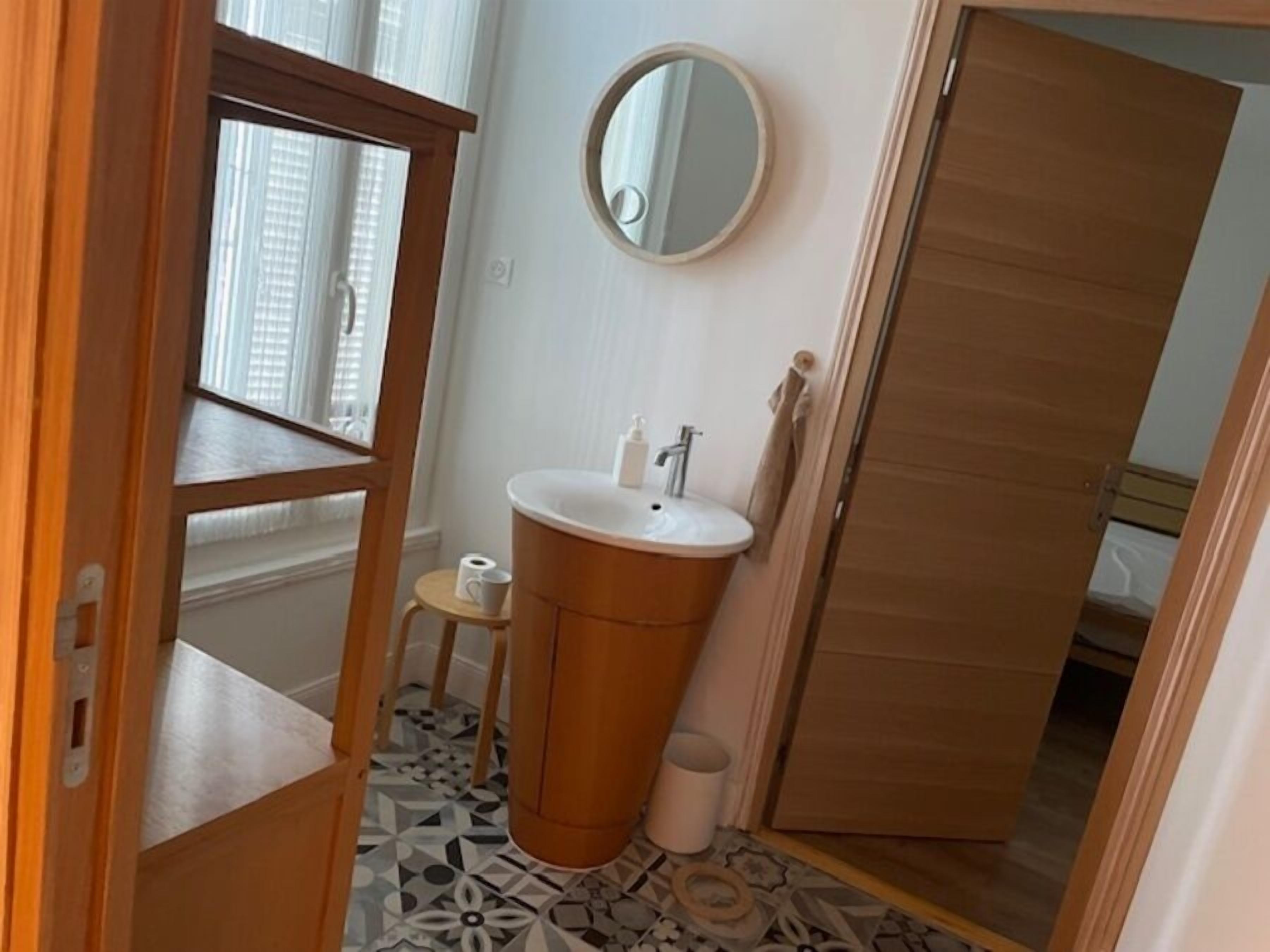deluxe suite | bathroom | shower, rainfall showerhead, hair dryer, towels