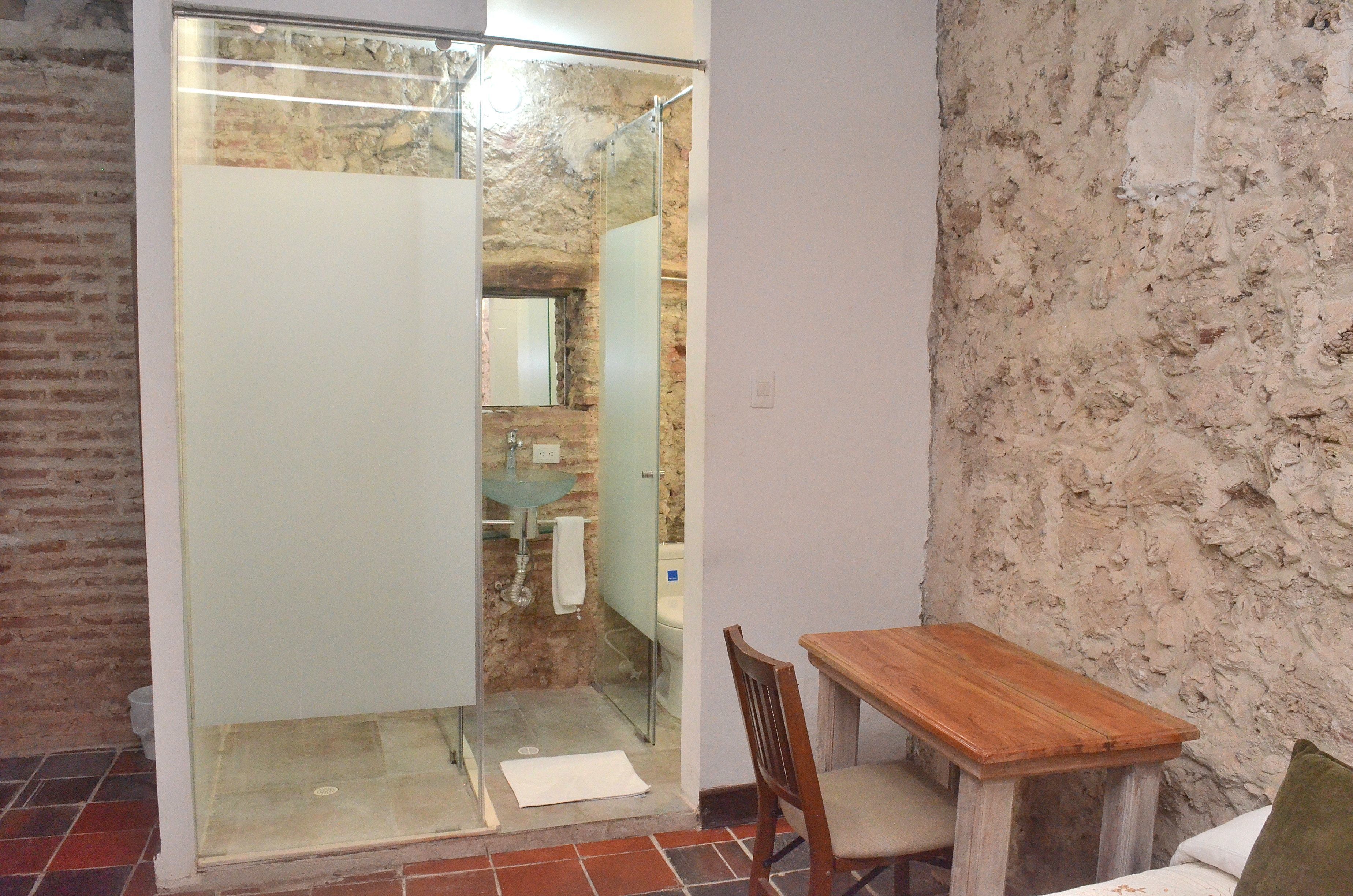 Quadruple Room | Bathroom | Shower, hair dryer, towels