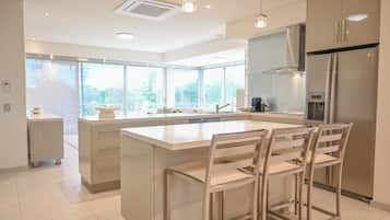 Pacific Penthouse | Private kitchen | Fridge, microwave, coffee/tea maker, electric kettle