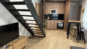 Comfort Duplex | Living area | 22-inch plasma TV with digital channels, TV