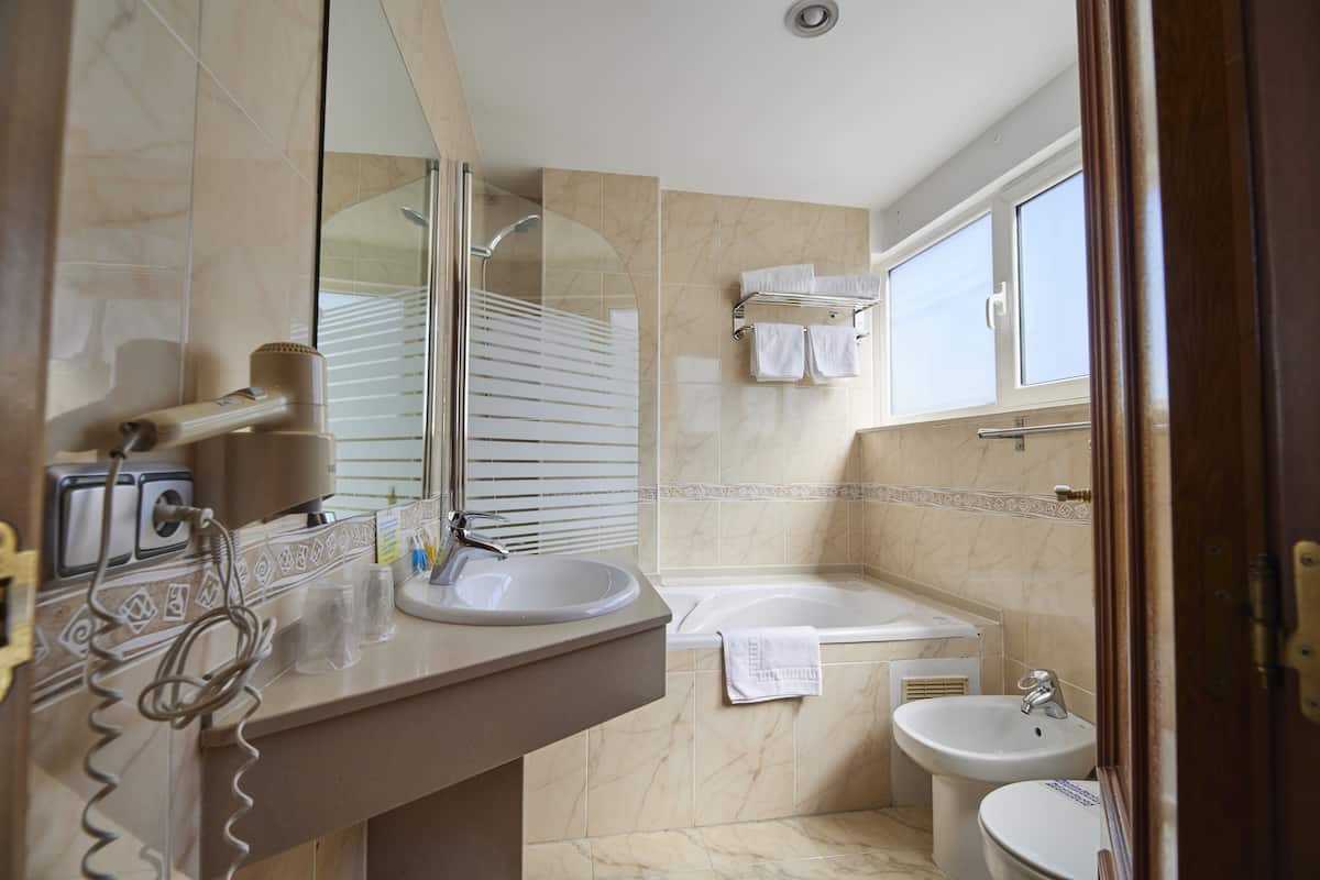 classic twin room | bathroom | free toiletries, hair dryer, towels