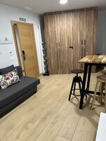 Comfort Studio Suite | Living area | 22-inch plasma TV with digital channels, TV