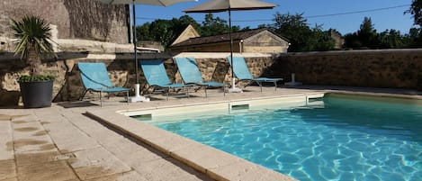 Seasonal outdoor pool, open 10:30 AM to 8 PM, pool loungers