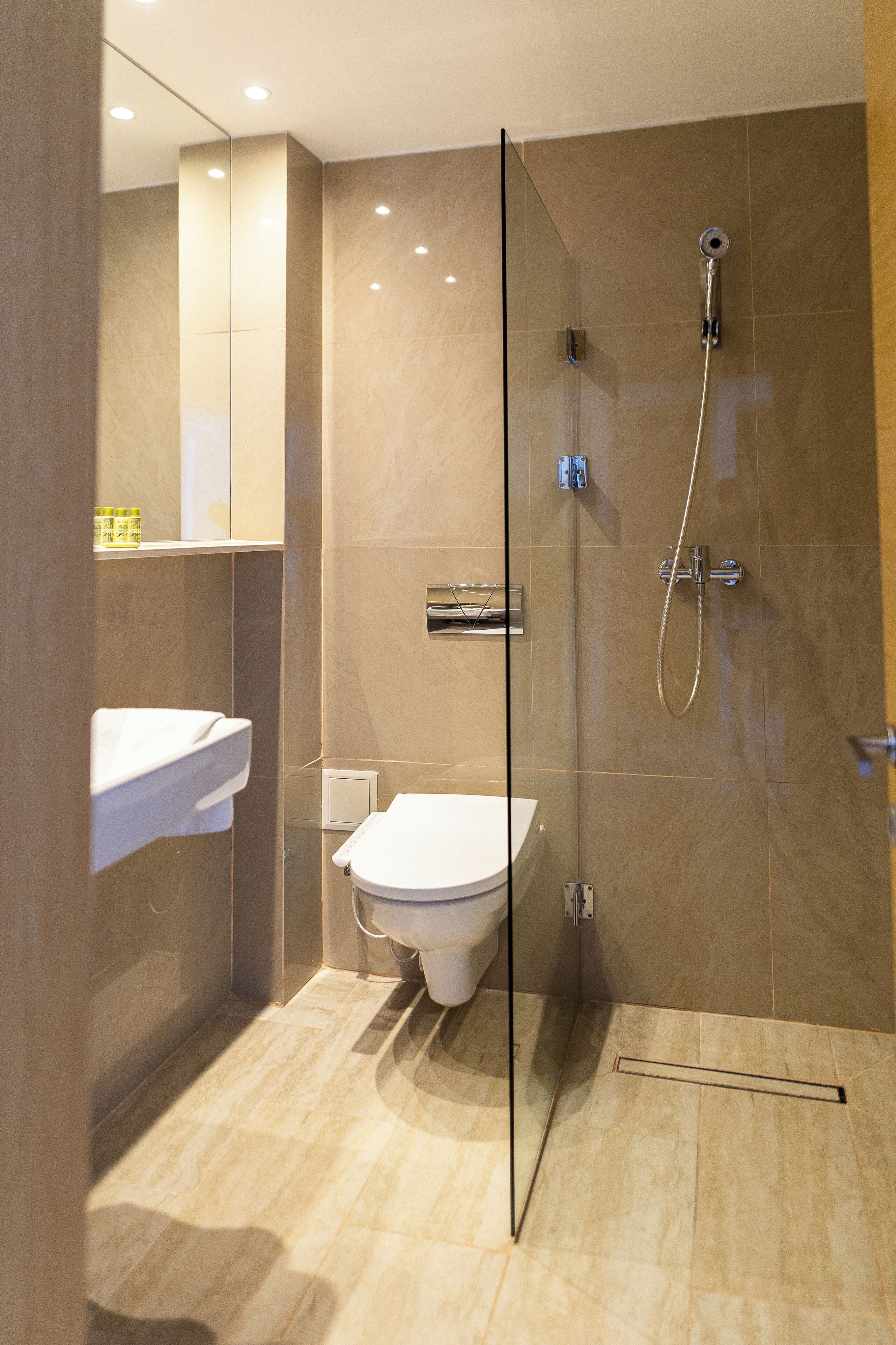 standard room | bathroom | shower, rainfall showerhead, designer toiletries, hair dryer