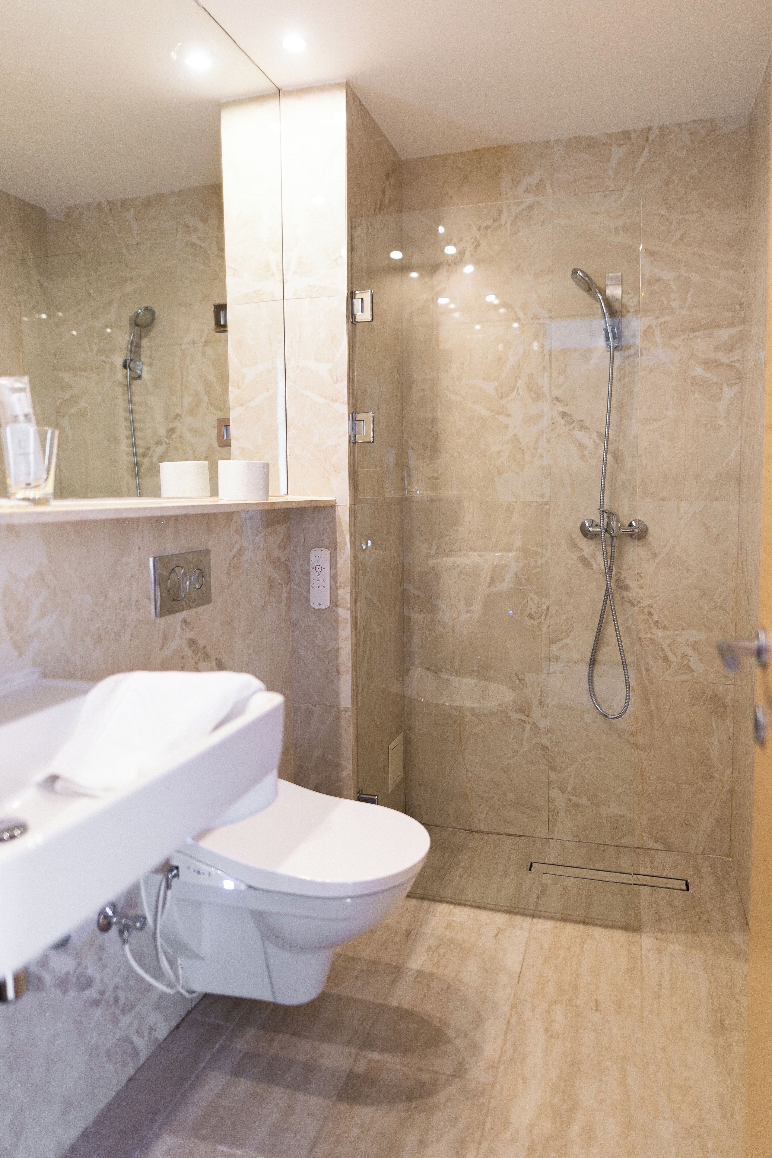 economy loft | bathroom | shower, rainfall showerhead, designer toiletries, hair dryer