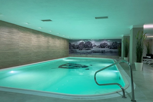 Indoor pool, sun loungers
