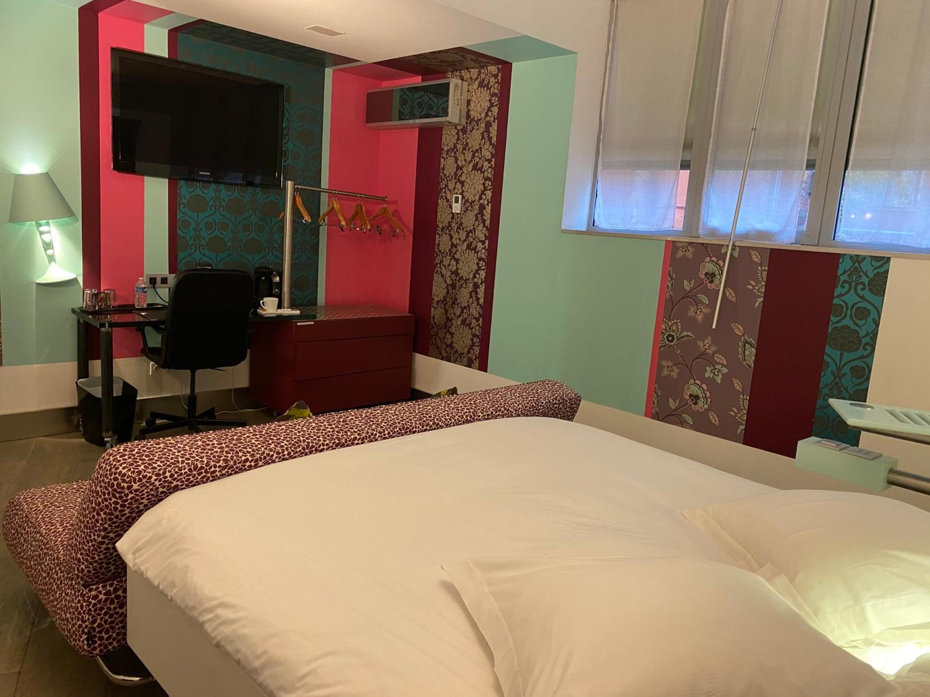 superior quadruple room | in-room safe, individually decorated, desk, iron/ironing board