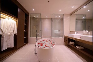 A modern bathroom with a freestanding bathtub, glass-enclosed shower, and a large mirror. - Bella Vista Waterfront Resort (Langkawi)