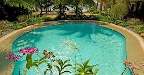 2 outdoor pools, open 7:00 AM to 9:00 PM, pool umbrellas, pool loungers
