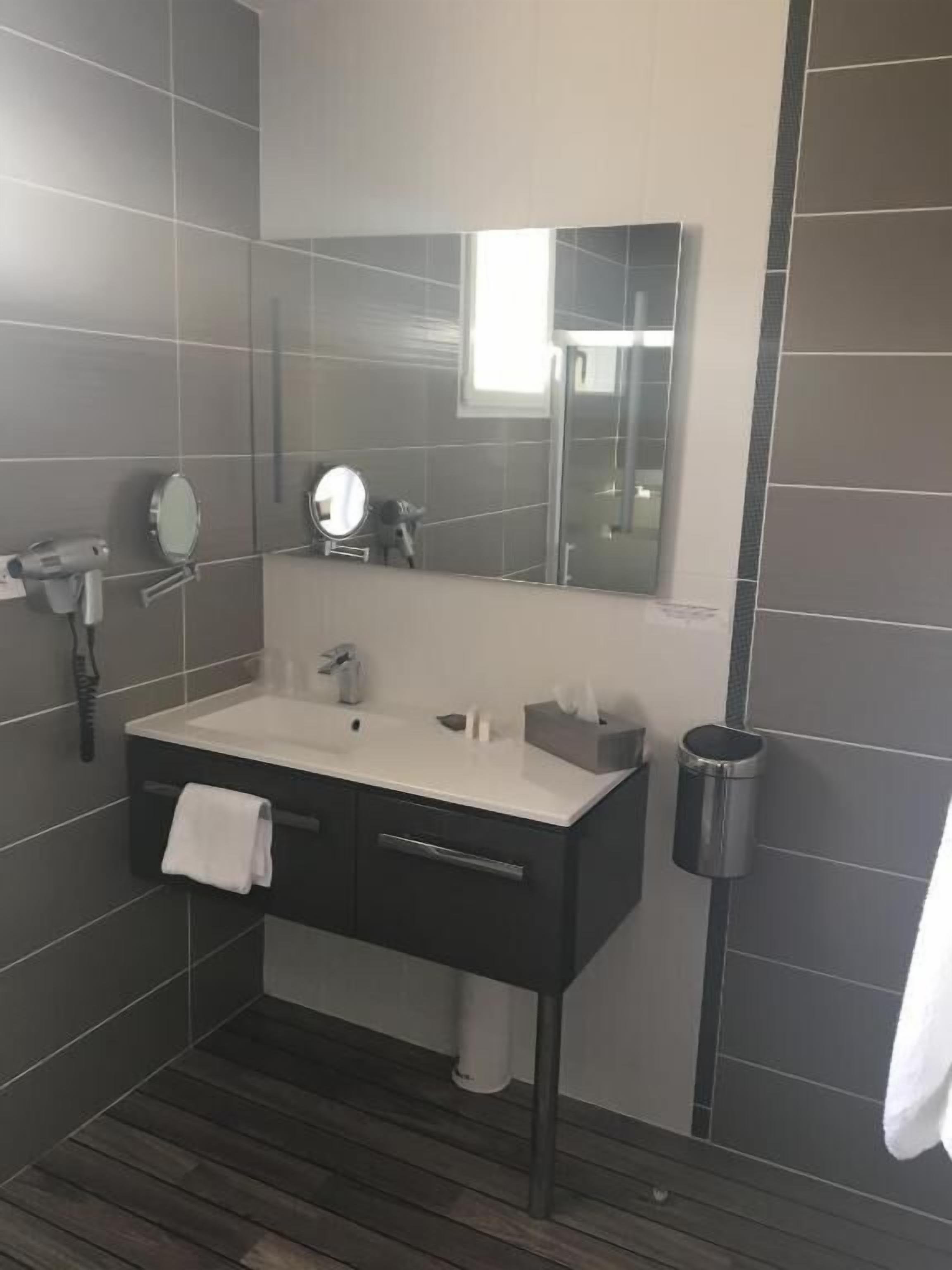 suite | bathroom | shower, hair dryer, towels