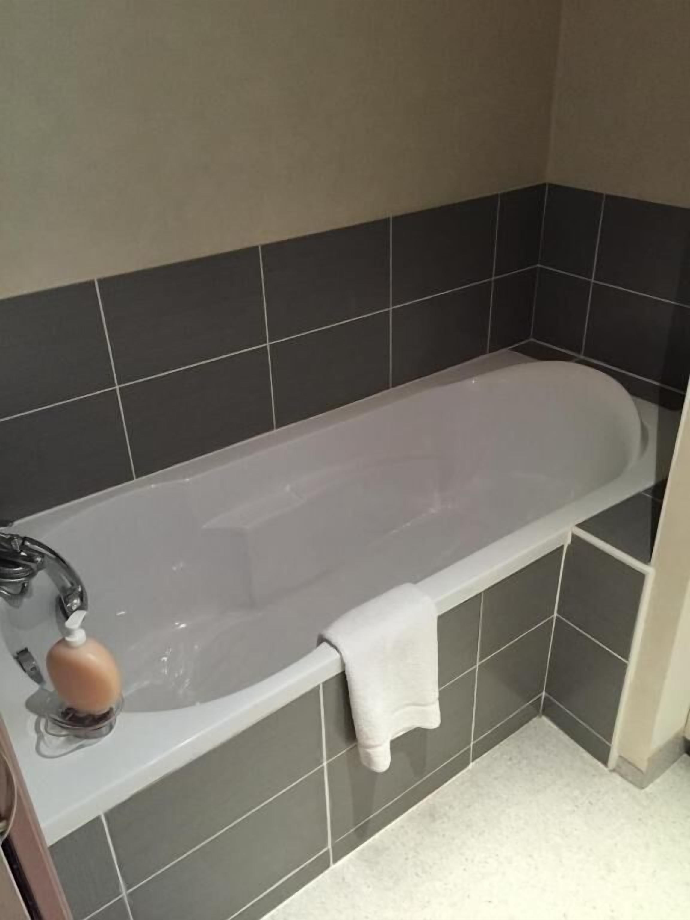 superior double room | bathroom | shower, hair dryer, towels