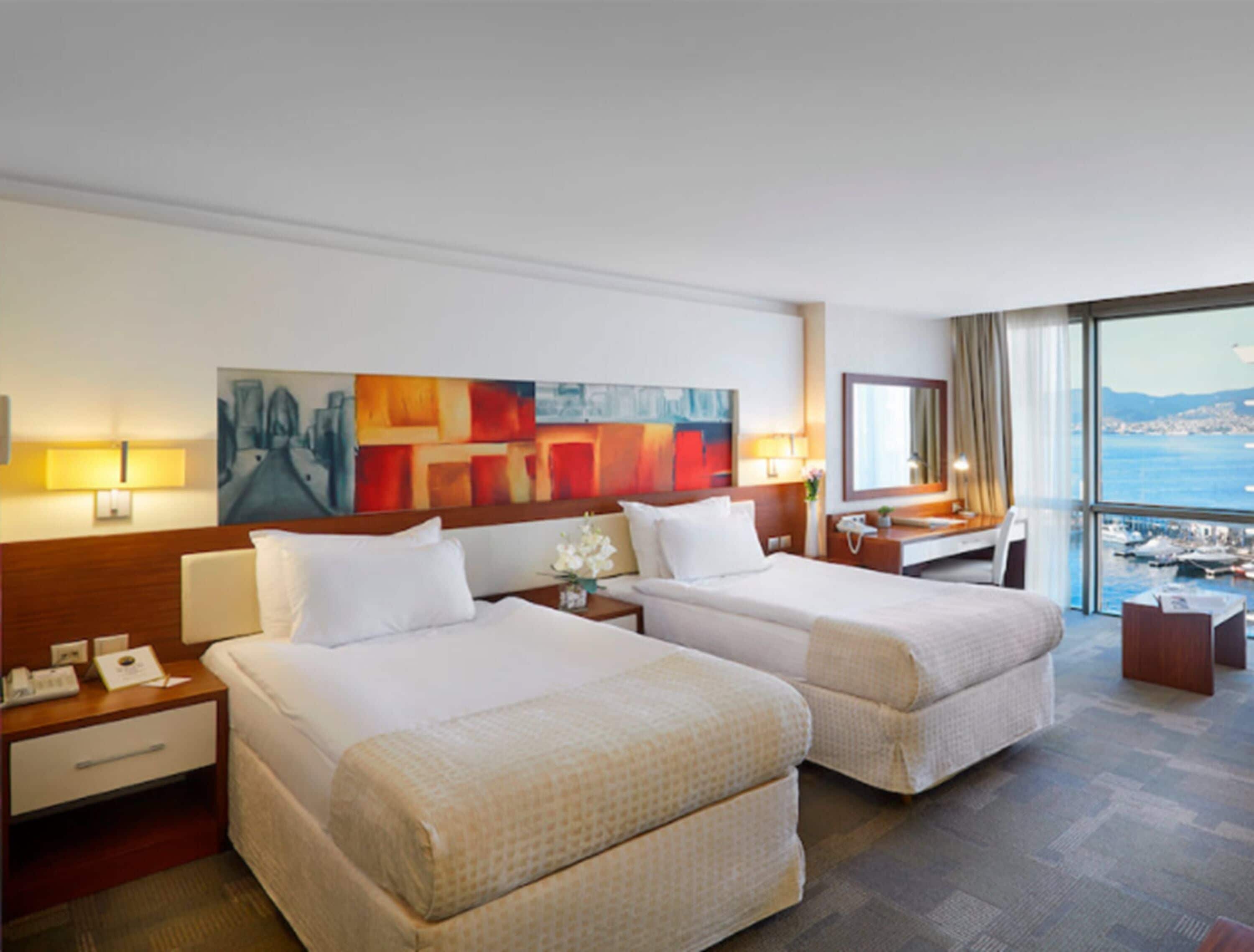 deluxe room | premium bedding, minibar, in-room safe, desk