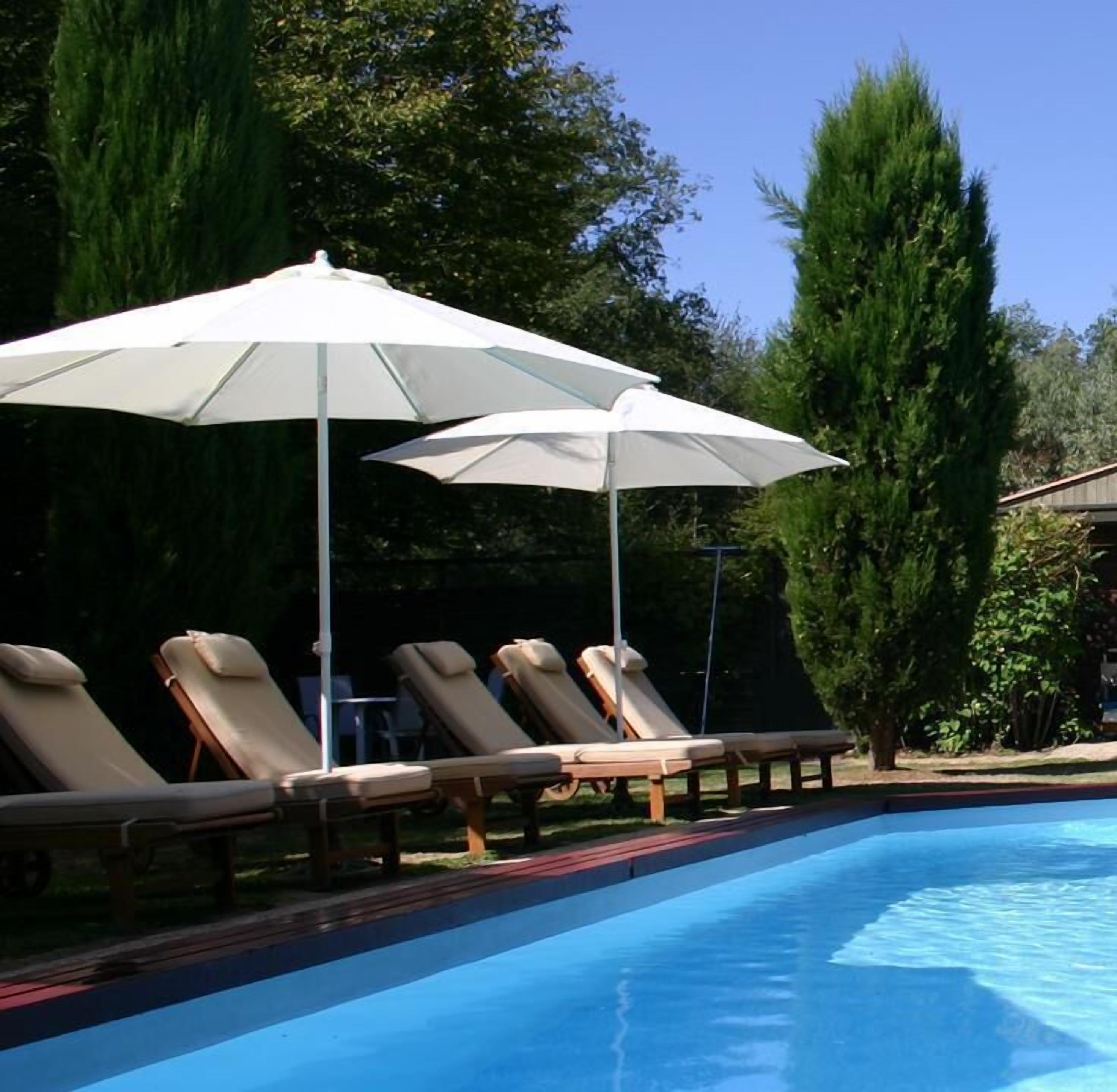outdoor pool, open 9:00 am to 9:00 pm, pool umbrellas, pool loungers