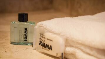 Shower, rainfall showerhead, hair dryer, towels