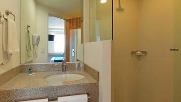 Shower, rainfall showerhead, hair dryer, towels