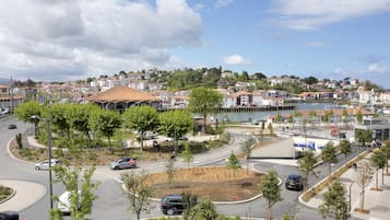 A coastal town with a roundabout, a marina, and residential buildings.