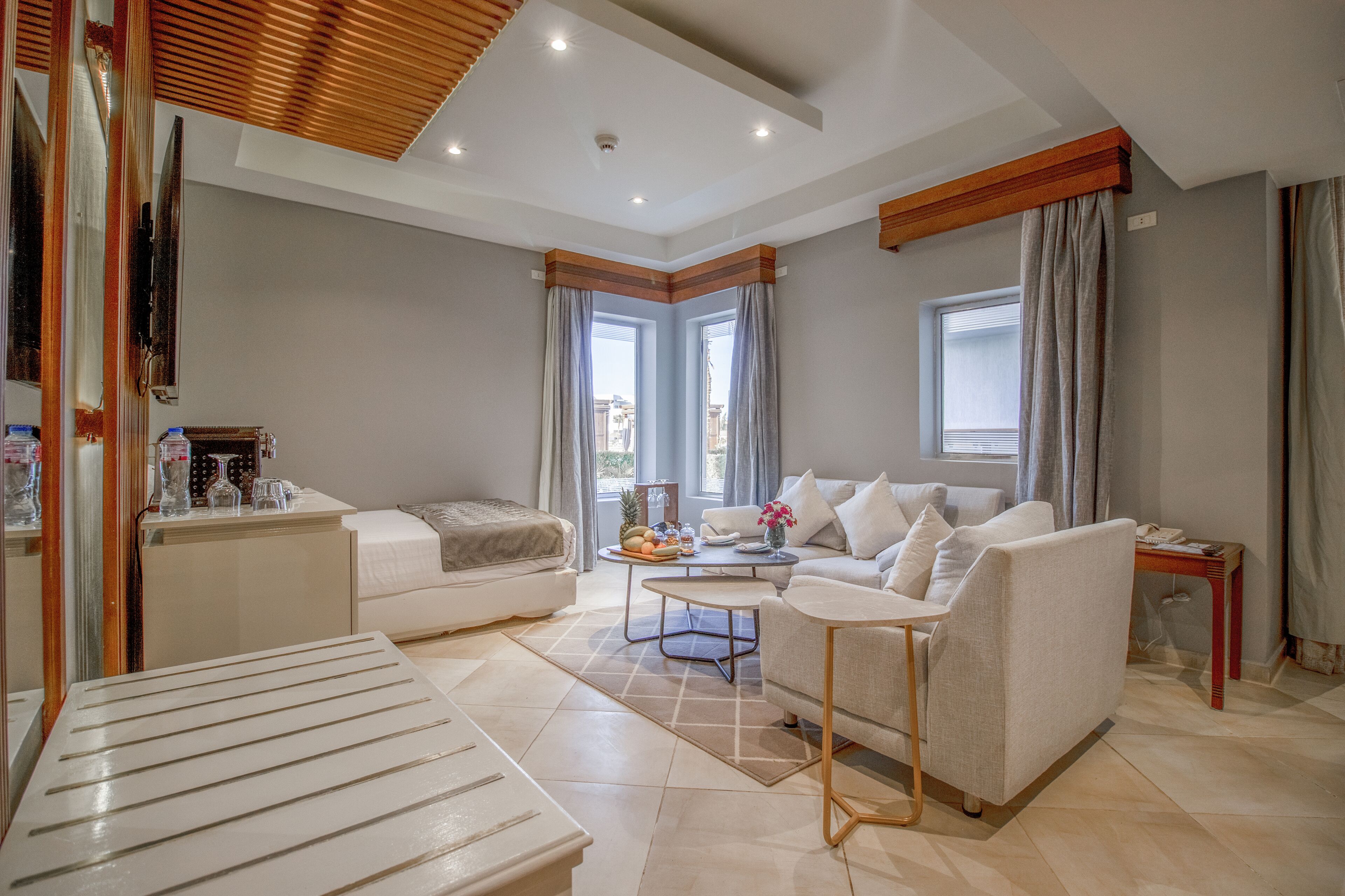 junior swim up suite (posh club) | living area | 40-inch lcd tv with satellite channels, tv, ping pong