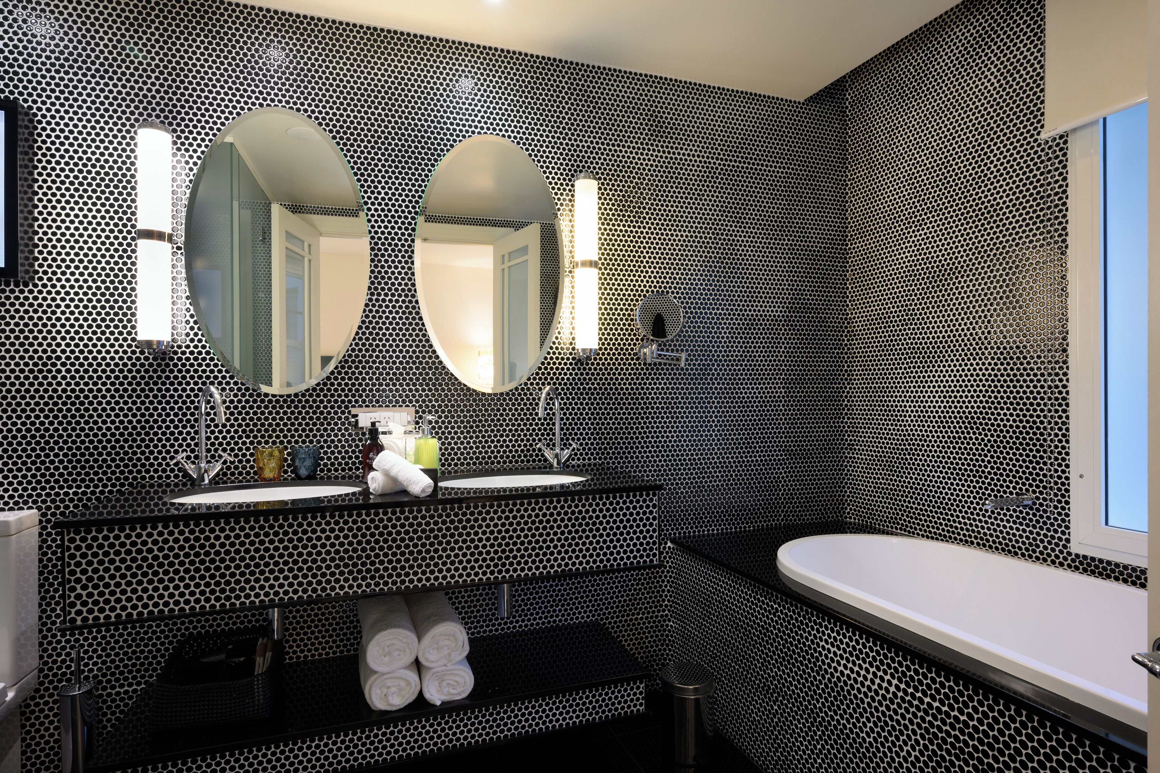 deluxe suite | bathroom | eco-friendly toiletries, hair dryer, bathrobes, slippers