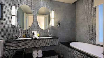 Deluxe Suite | Bathroom | Eco-friendly toiletries, hair dryer, bathrobes, slippers