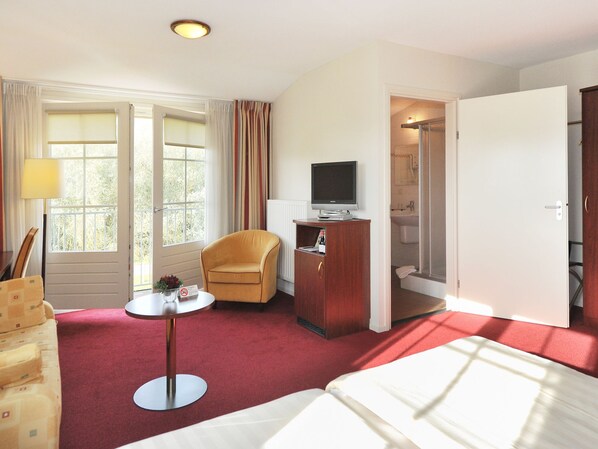 Chambre Confort double, 2 lits jumeaux | Minibar, coffre-fort, bureau, rideaux d’obscurcissement