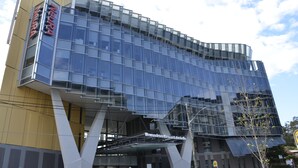 A modern building with a glass facade and a sign that reads "Neura." - Perouse Randwick by Sydney Lodges (Randwick)