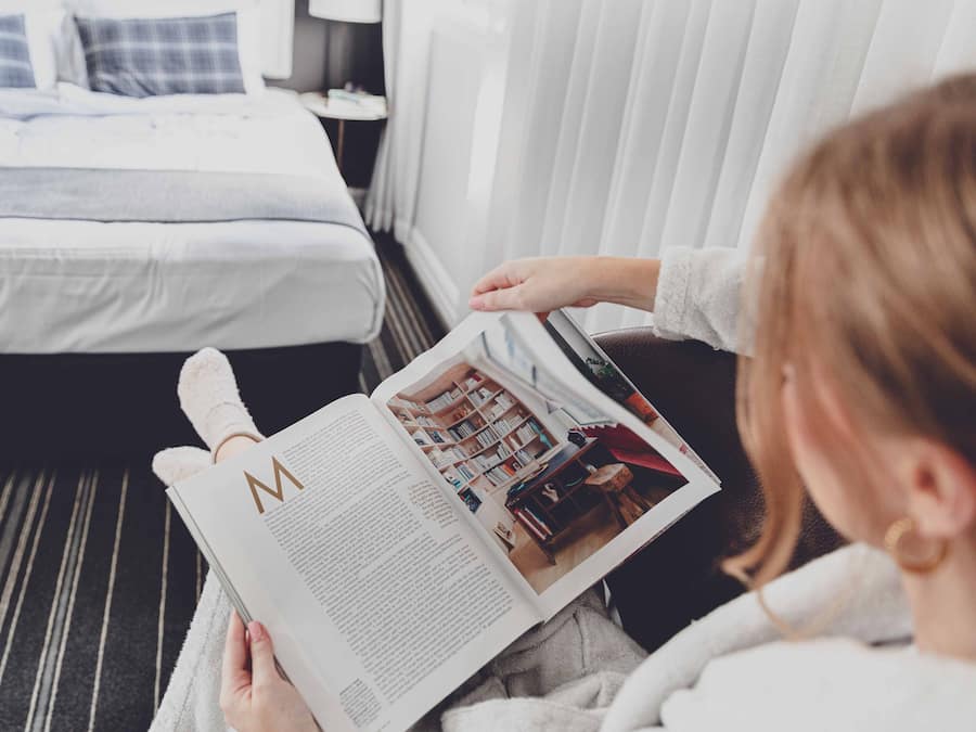 Premium bedding, desk, laptop workspace, blackout drapes