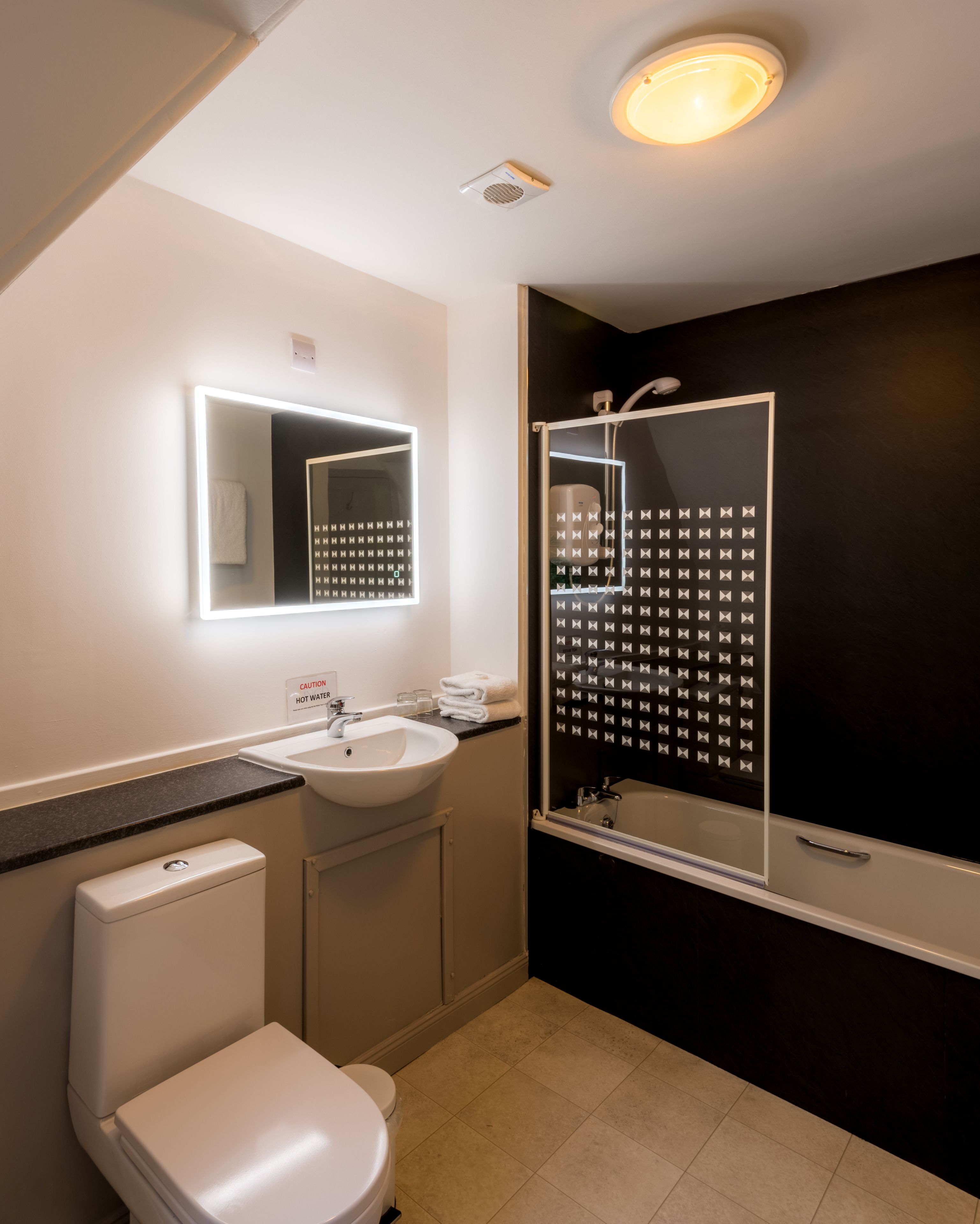 superior double room | bathroom | shower, hair dryer, towels