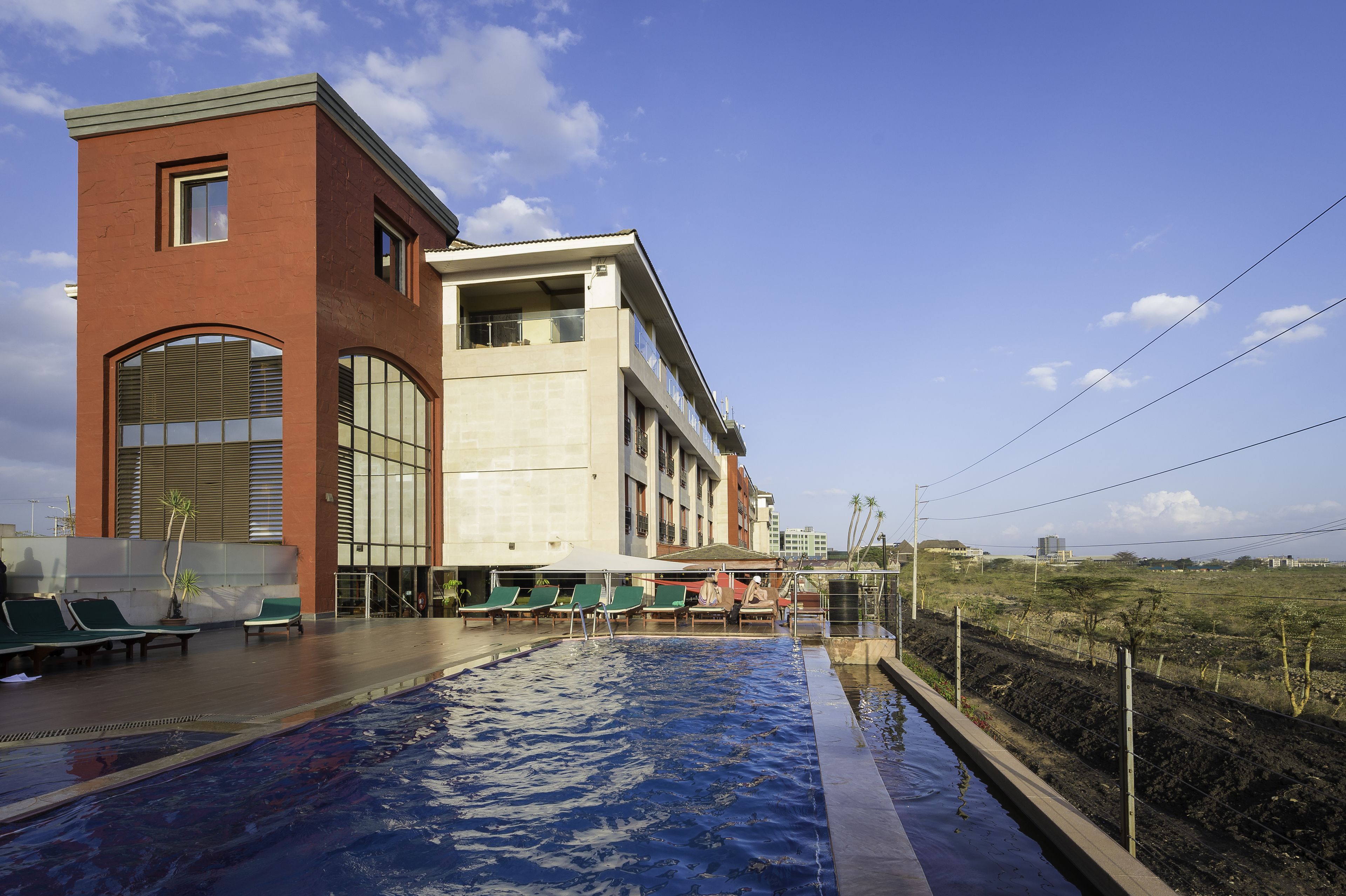 outdoor pool, pool umbrellas, pool loungers