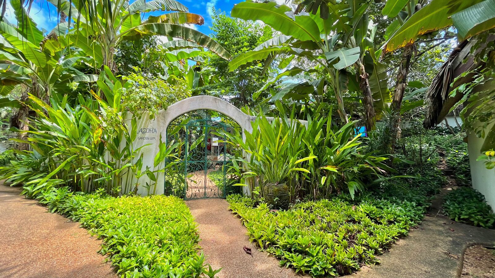 A lush garden with a central archway labeled "AZORIA GARDEN GYM".
