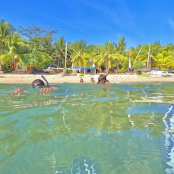 On the beach, sun-loungers, beach umbrellas, scuba diving