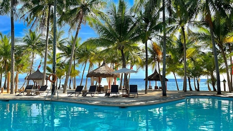 4 outdoor pools, pool umbrellas, sun loungers. Coco Grove Beach Resort