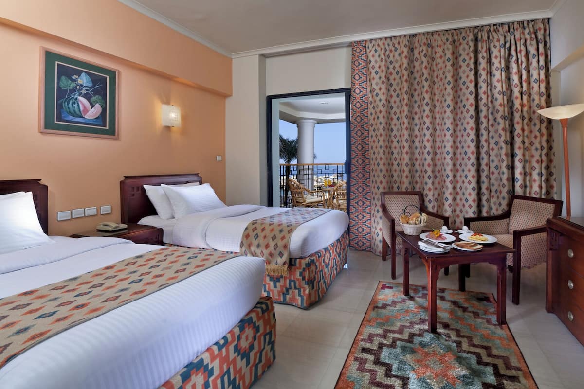 Standard Room, Sea View | 1 bedroom, free minibar items, in-room safe, individually decorated