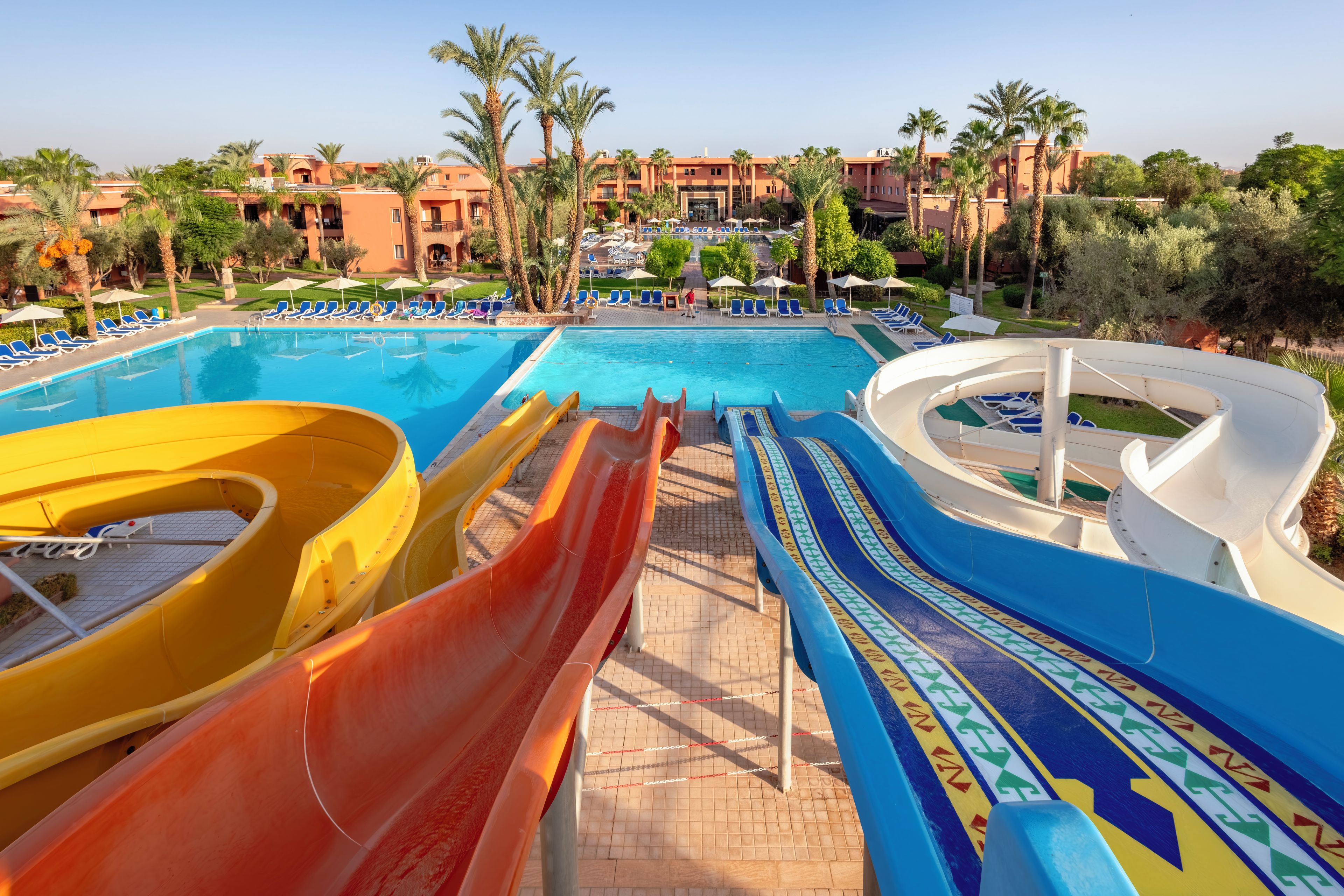 A water park with multiple slides and a pool area.