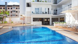 A modern hotel with a swimming pool, outdoor seating, and balconies. - BQ Carmen Playa Hotel - Adults Only (Palma de Mallorca)
