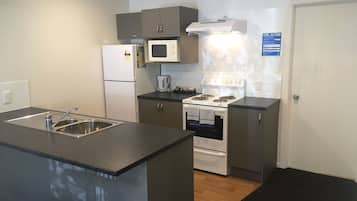 Superior One Bedroom | Private kitchen | Full-sized fridge, microwave, oven, stovetop