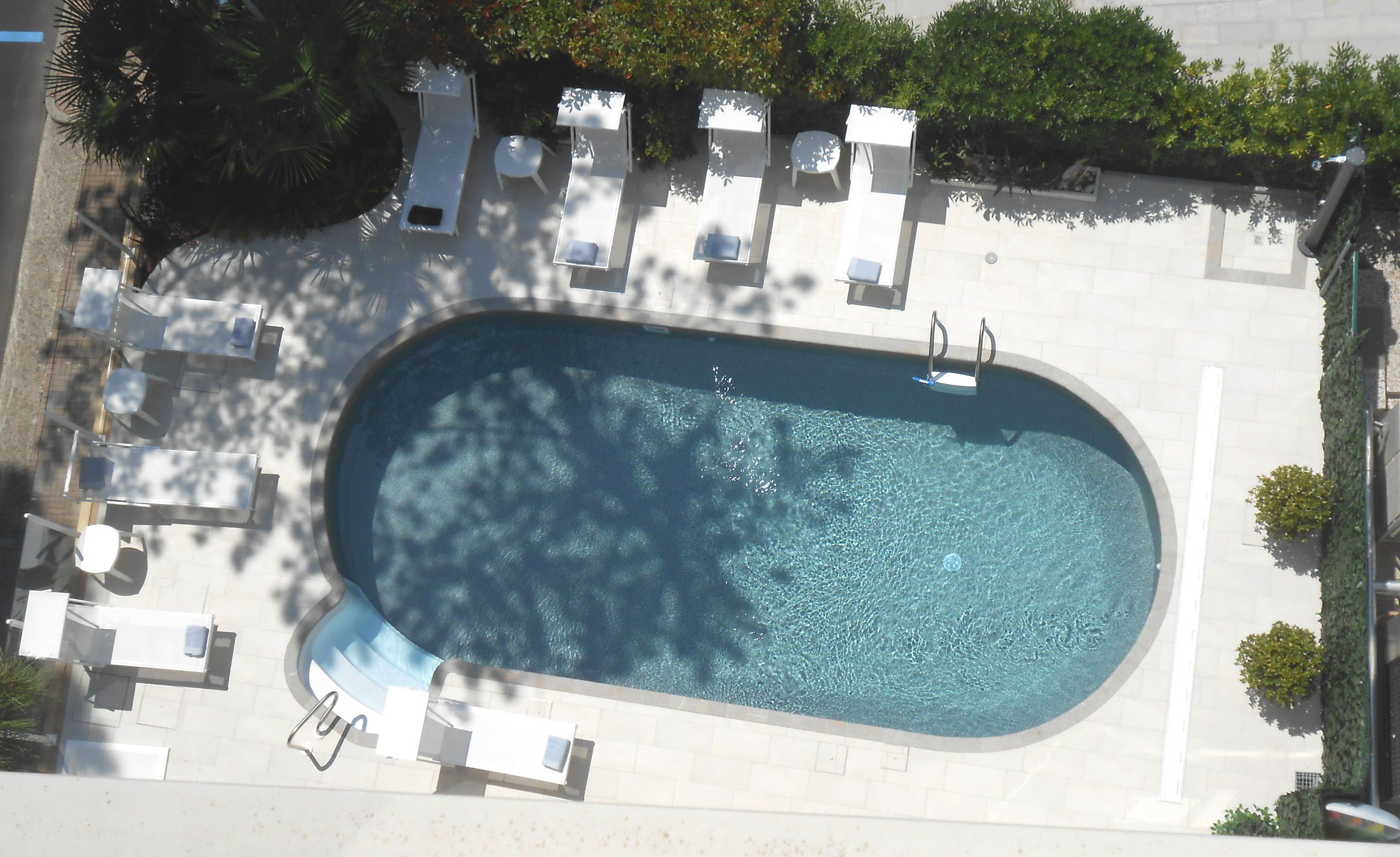 outdoor pool, open 10:00 am to 7:30 pm, pool loungers