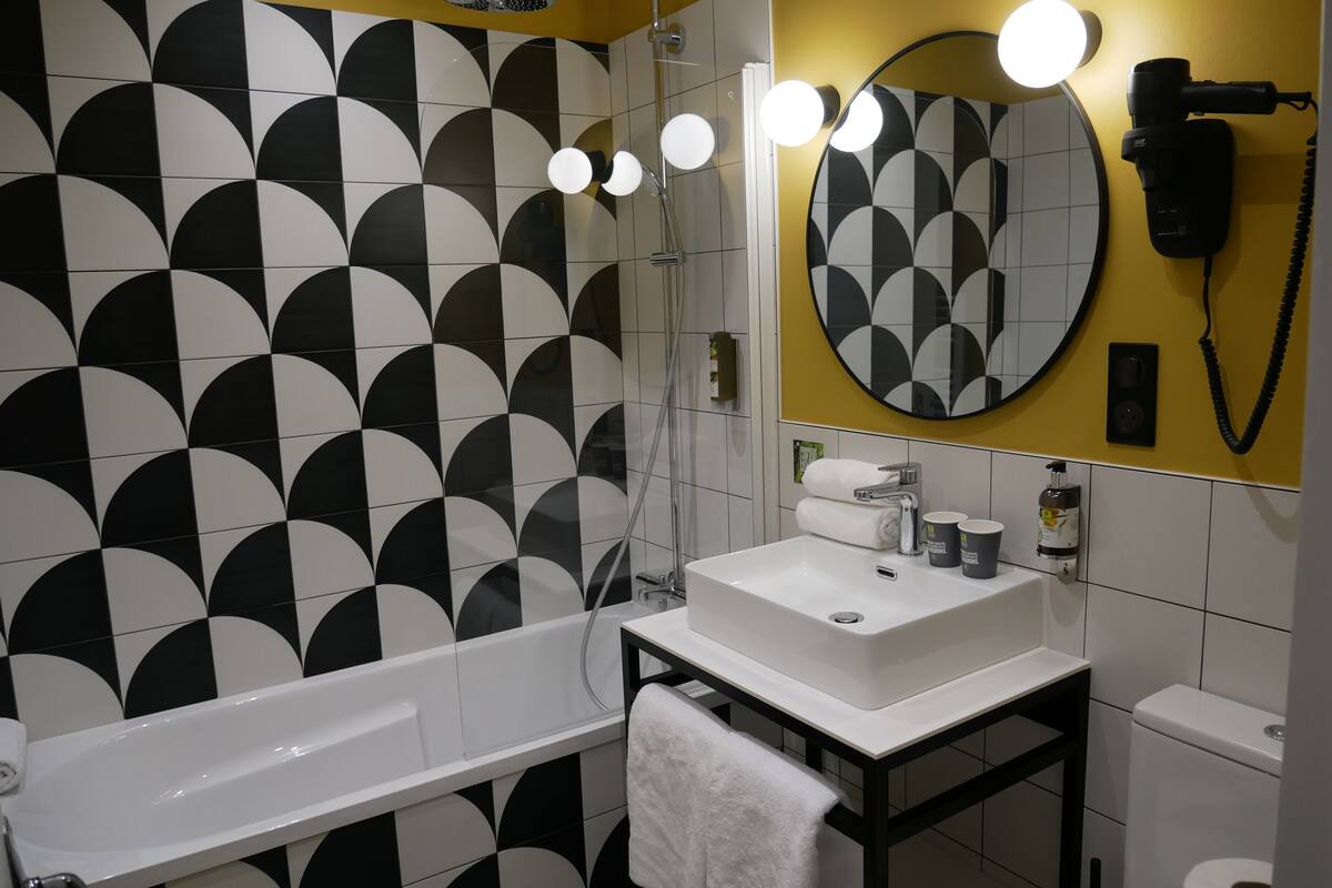 superior double room | bathroom | rainfall showerhead, hair dryer, towels