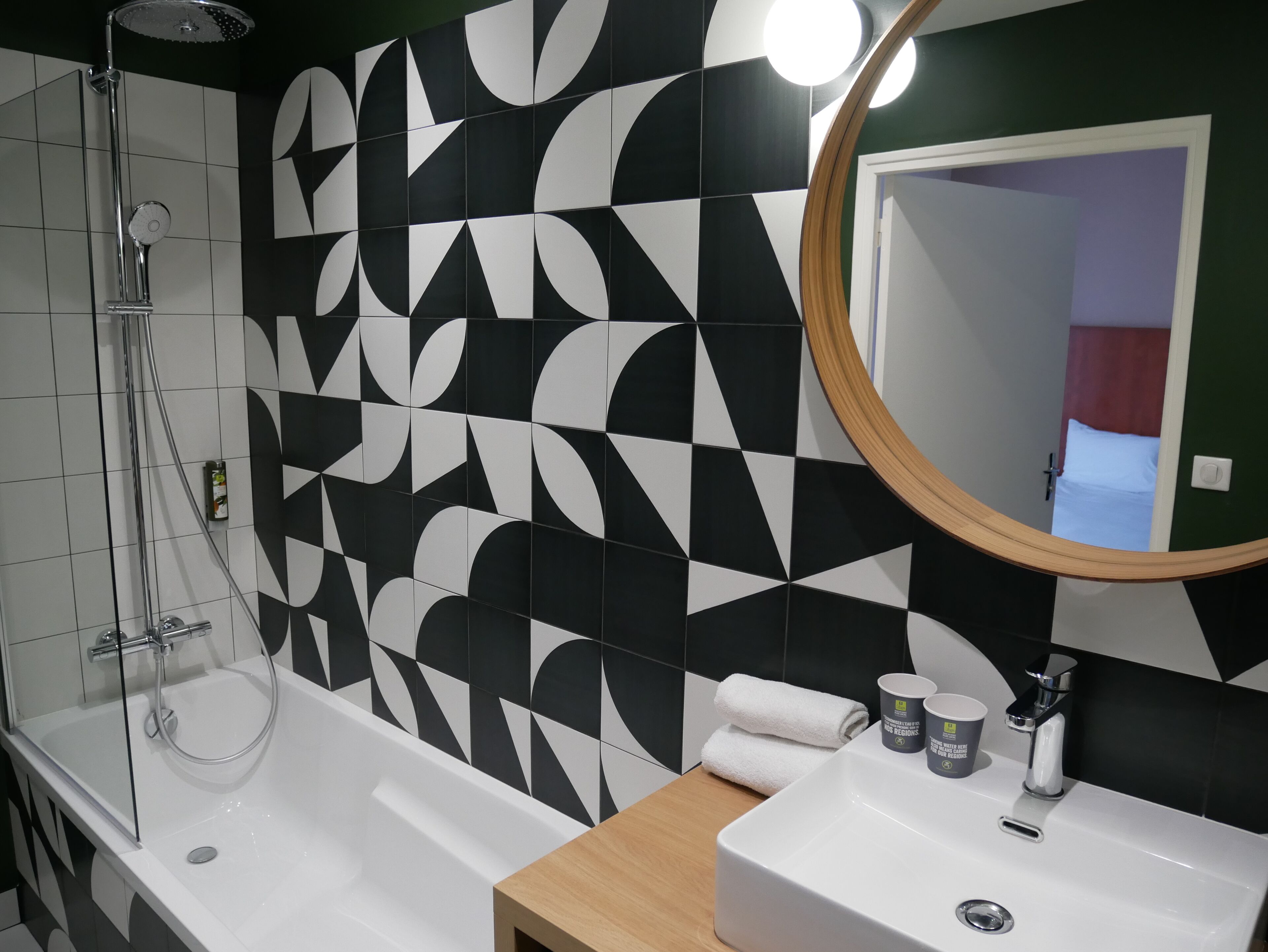 superior double room | bathroom | rainfall showerhead, hair dryer, towels
