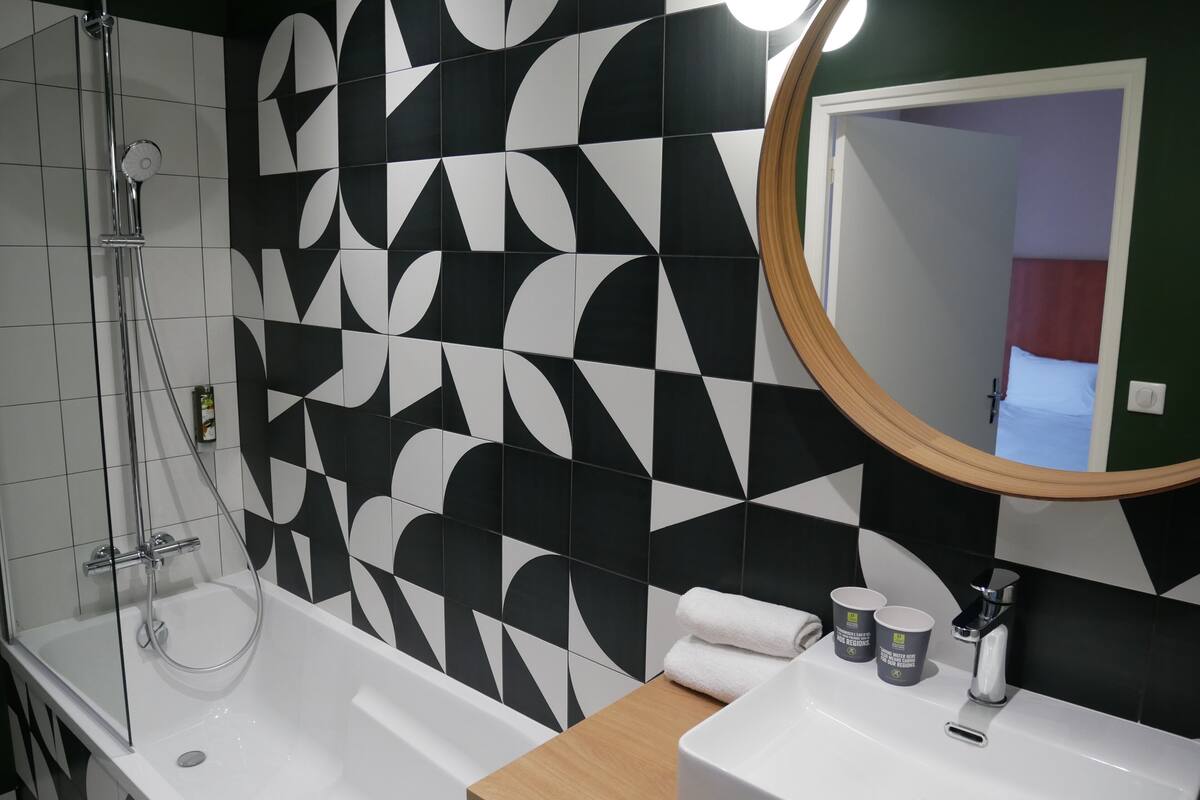 superior double room | bathroom | rainfall showerhead, hair dryer, towels