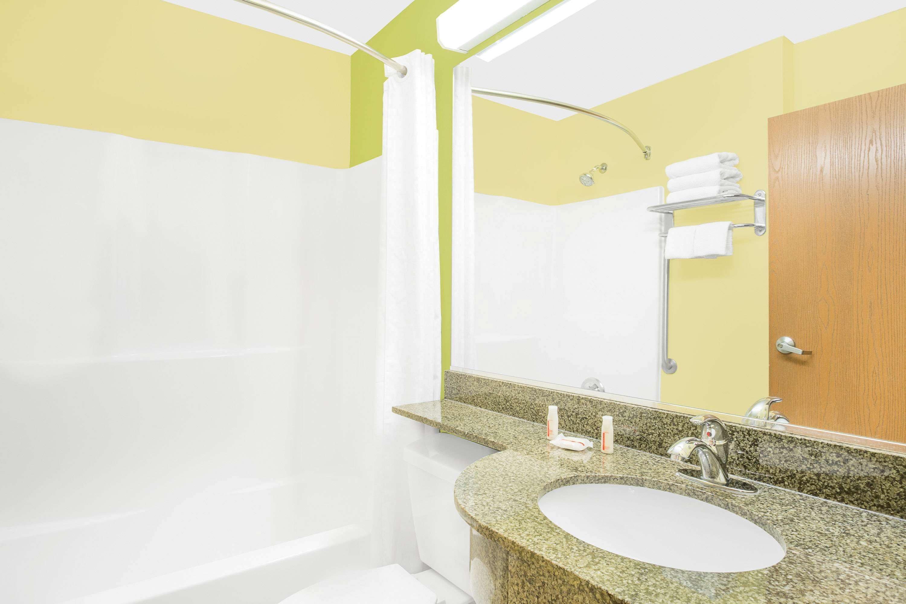 combined shower/bathtub, free toiletries, hair dryer, towels