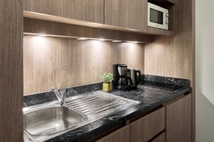 Fridge, microwave, stovetop, cookware/dishes/utensils