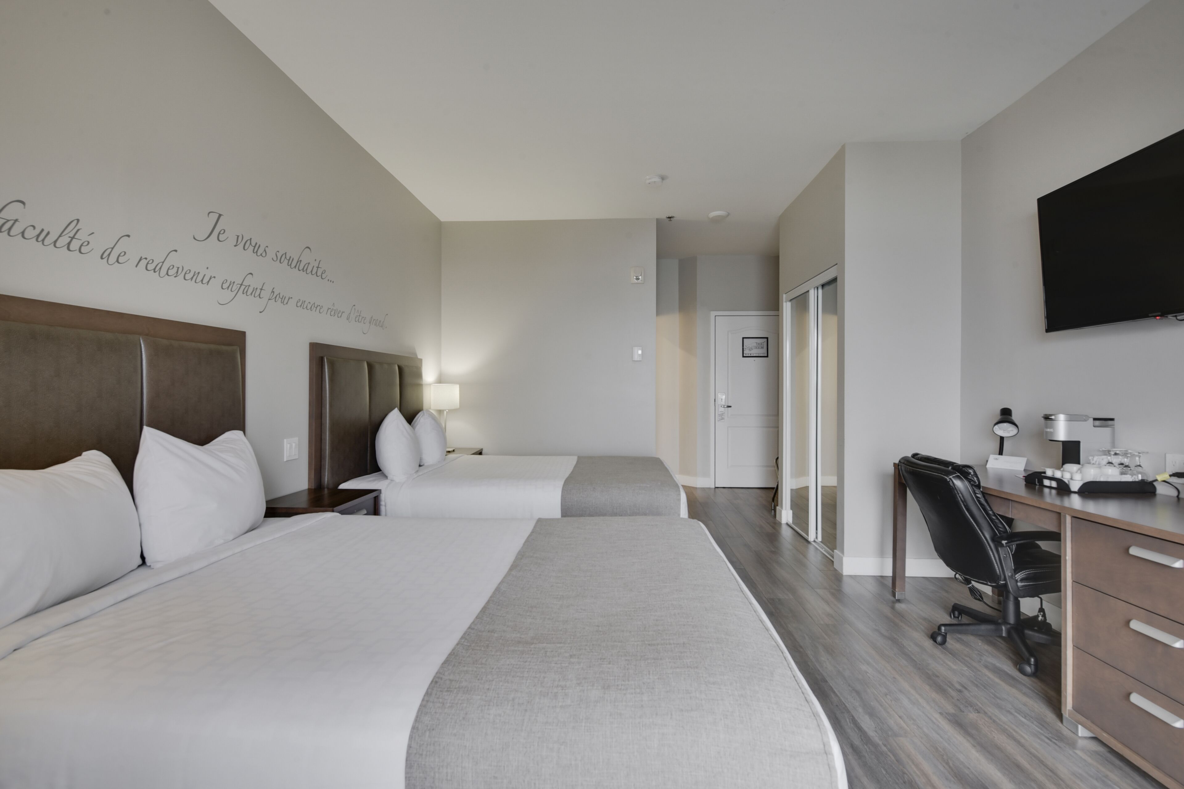 HOTEL | Economy Room, 2 Queen Beds Courtyard View | In-room safe, individually decorated, individually furnished, desk