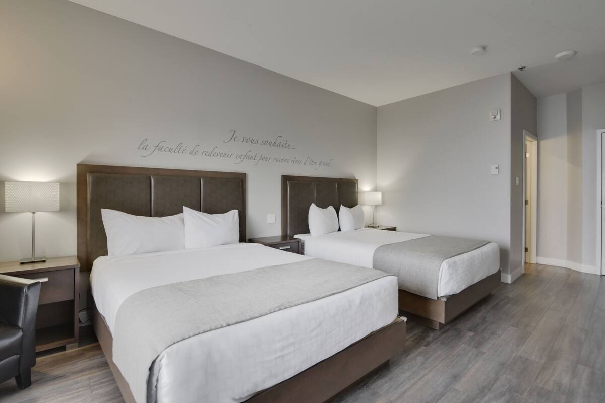 hotel | economy room, 2 queen beds courtyard view | 1 bedroom, in-room safe, individually decorated, individually furnished